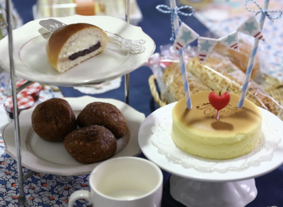A cream tea with jam, cream and scones